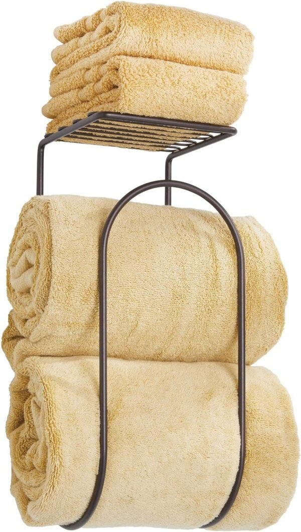 mDesign Modern Metal Wire Wall Mount Towel Rack Holder and Organizer with Storage Shelf - for Bathroom Towels, Washcloths, Hand Towels - Decorative Curved Design - Bronze